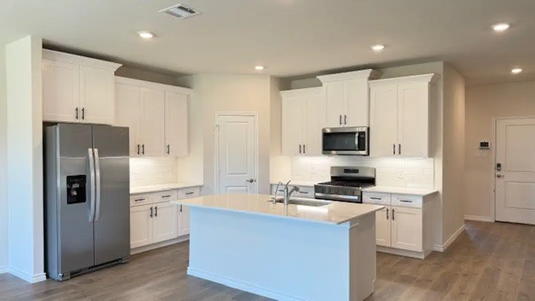 Furnished interior view inside a new home in Prairie Oaks, Oak Point (Image 6).