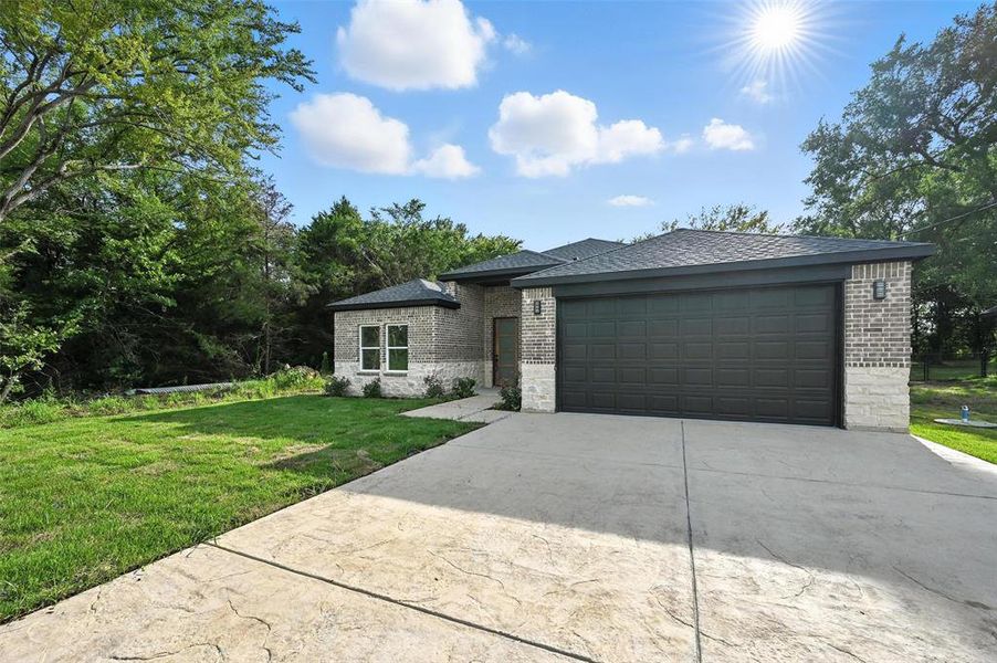 Front exterior of a new home in , Tool, TX, highlighting curb appeal (Image 1). Front exterior of a new home in , Tool, TX, highlighting curb appeal (Image 1).