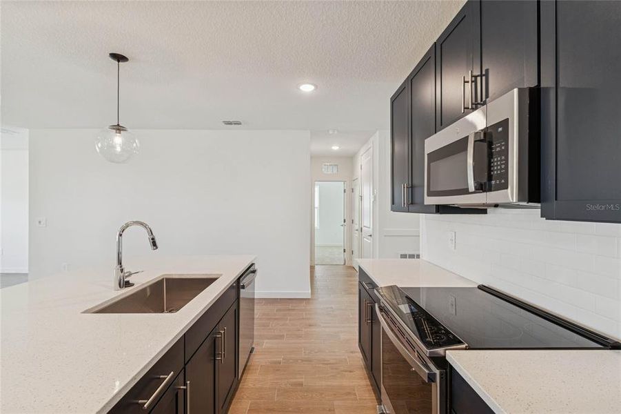 Furnished interior view inside a new home in Aspire at Canter Creek, Davenport (Image 16).