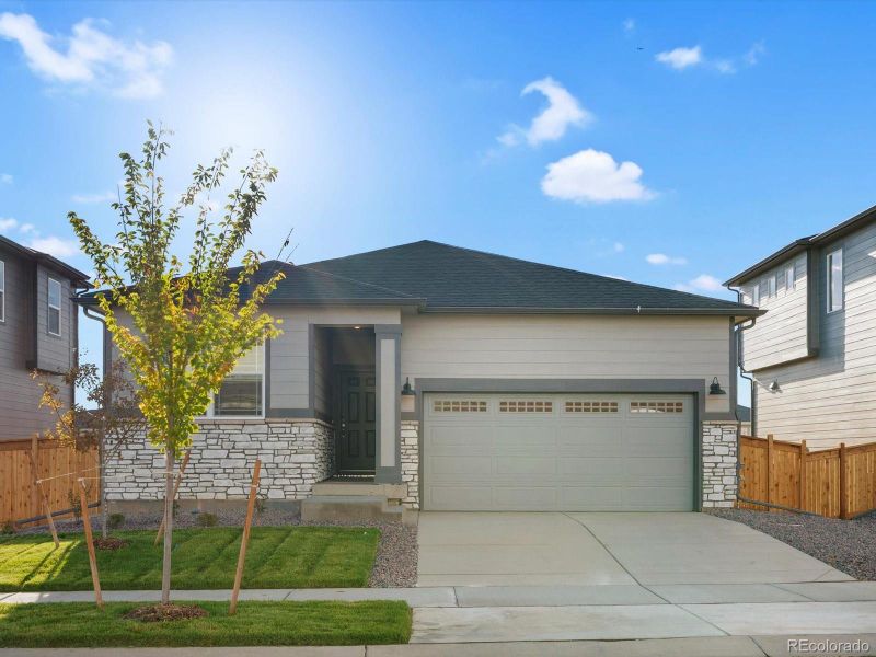 Front exterior of a new home in Buffalo Highlands: The Flora Collection, Commerce City, CO, highlighting curb appeal (Image 2).