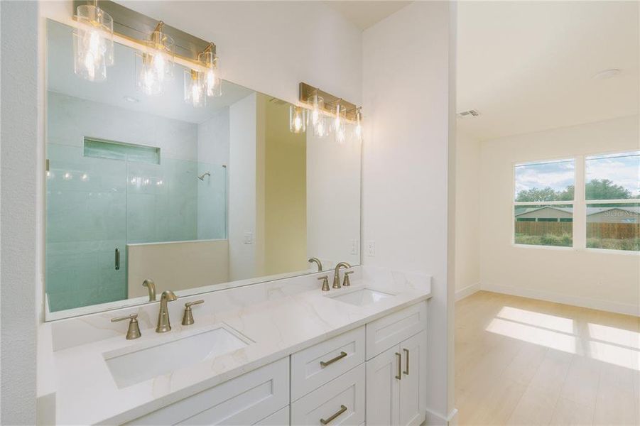 Primary Bathroom with a walk-in shower