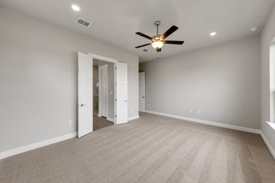 Unfurnished bedroom with carpet flooring, recessed lighting, and a ceiling fan Unfurnished bedroom with carpet flooring, recessed lighting, and a ceiling fan