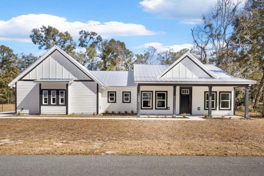 Front exterior of a new home in , Fanning Springs, FL, highlighting curb appeal (Image 24).