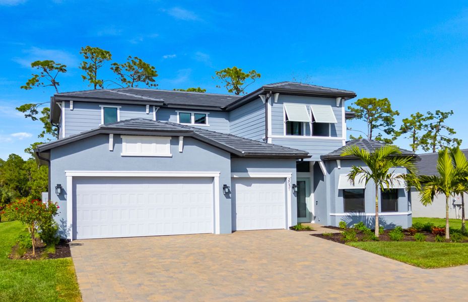 Front exterior of a new home in Terreno, Naples, FL, highlighting curb appeal (Image 17).