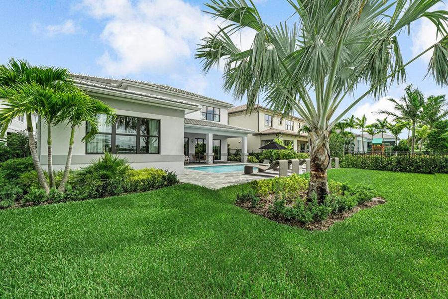 Exterior details and patio area of a home in Apex at Avenir, Palm Beach Gardens (Image 35).
