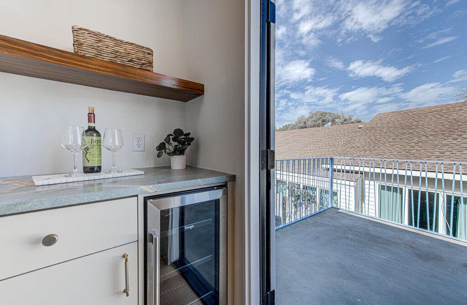 Bar featuring a dry bar and wine cooler