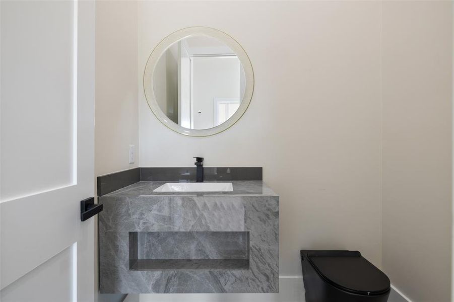 Bathroom featuring sink and toilet