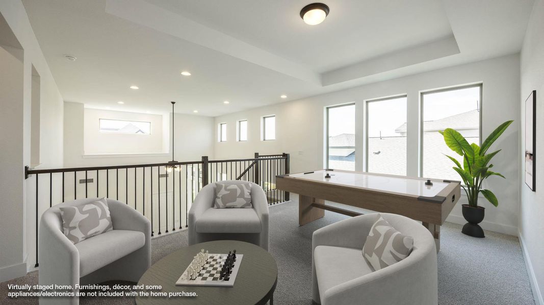 Recreation room with carpet floors, recessed lighting, and a tray ceiling Recreation room with carpet floors, recessed lighting, and a tray ceiling