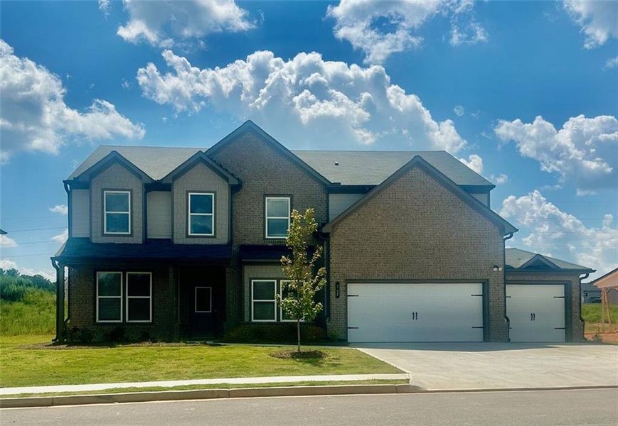 Front exterior of a new home in , Auburn, GA, highlighting curb appeal (Image 1). Front exterior of a new home in , Auburn, GA, highlighting curb appeal (Image 1).
