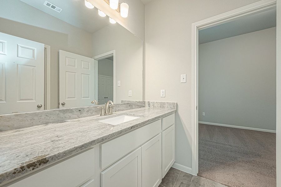 Representative furnished interior of a home built from the Floor Plan 2050 by Colina Homes in Grand Magnolia, Magnolia (Image 31).