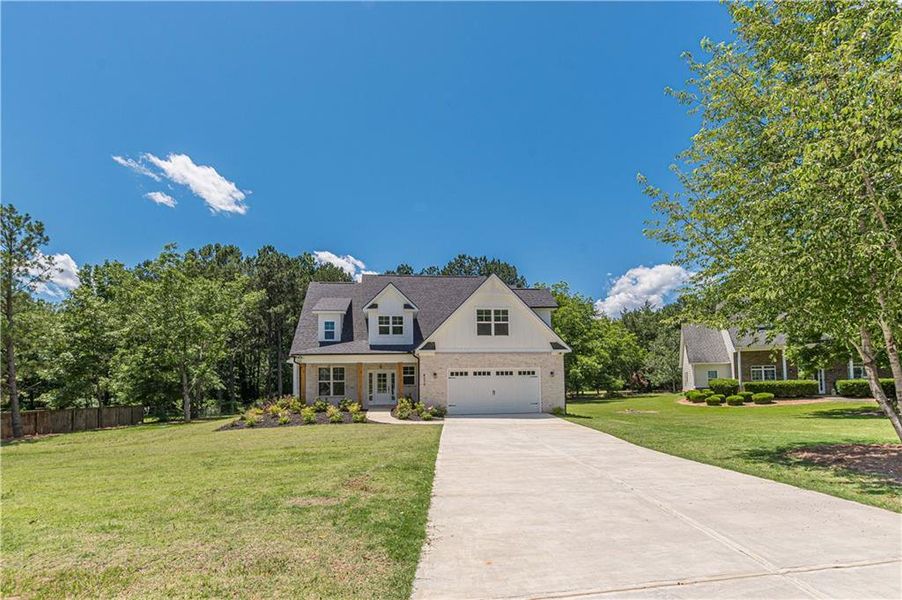 Front exterior of a new home in , McDonough, GA, highlighting curb appeal (Image 1).