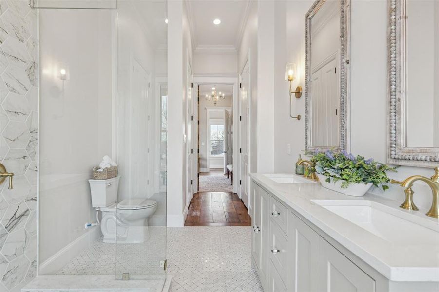 primary bathroom with separate soaking tub, shower, and dual sinks
