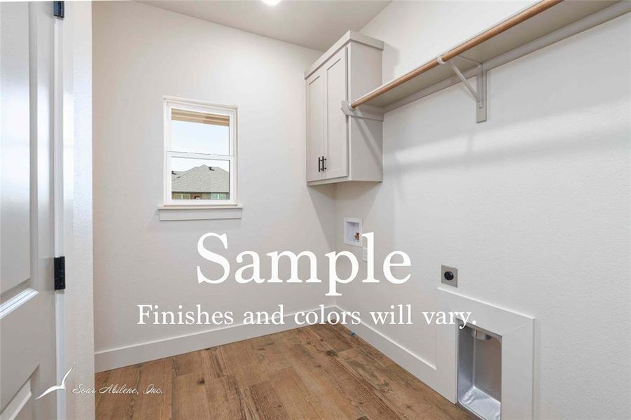 Laundry room with built in cabinets, extra room for a fridge or freezer and closet storage. Laundry room with built in cabinets, extra room for a fridge or freezer and closet storage.