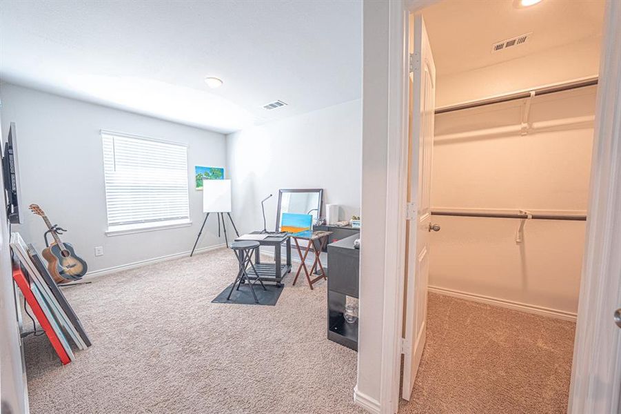 Office area featuring light carpet and recessed lighting