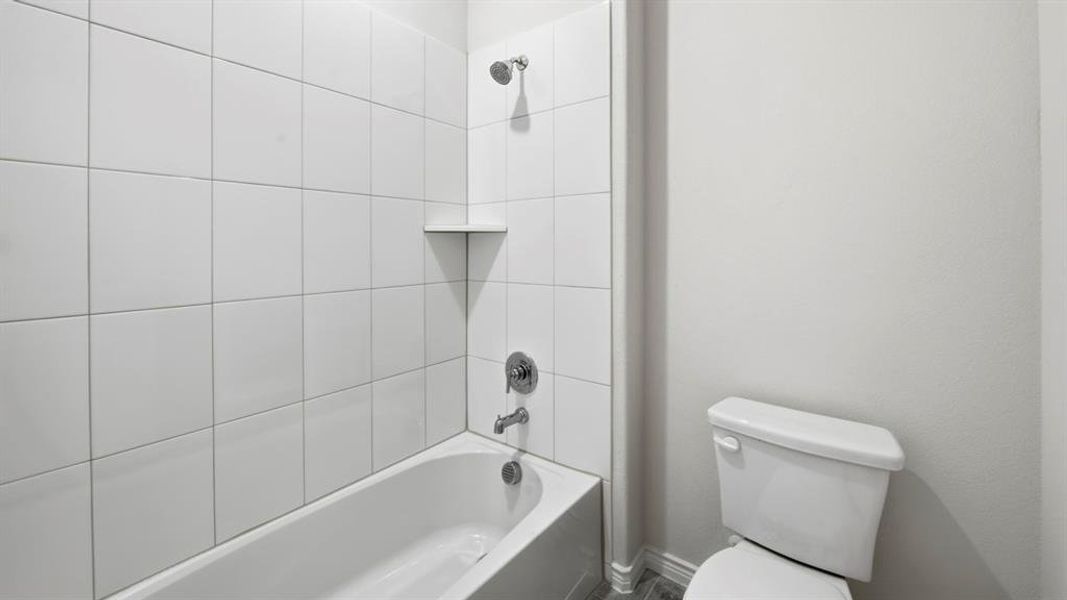 Full bathroom with  shower combination and toilet