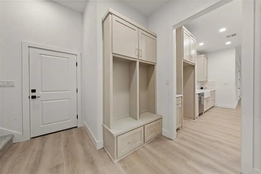 Mudroom featuring light wood-style flooring and recessed lighting Mudroom featuring light wood-style flooring and recessed lighting