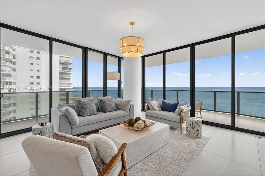 Light filled open living area with floor to ceiling glass and seamless indoor outdoor flow to expansive terrace.