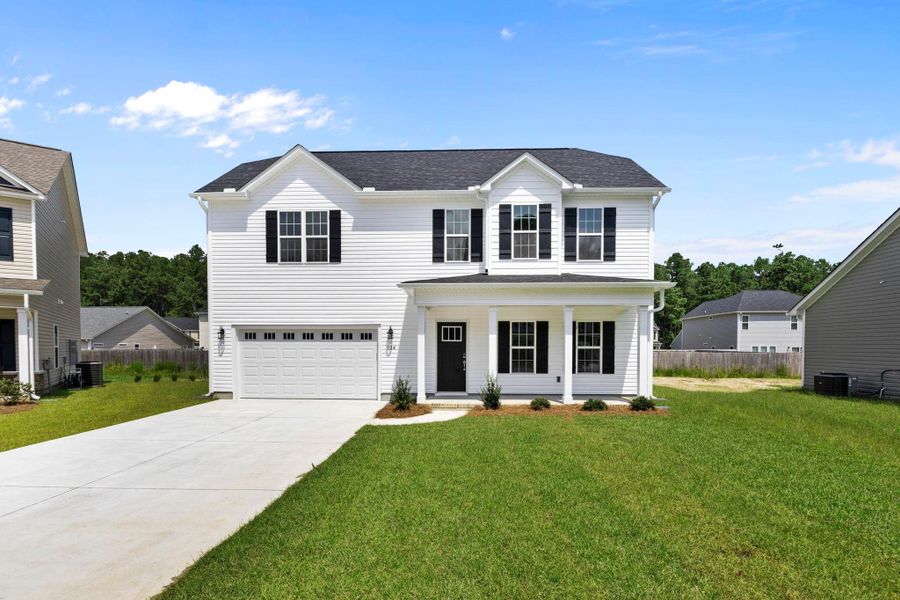 Representative exterior photo of a completed home built from the Tyler A by JC Jackson Homes,LLC in Heritage Pointe, Newport, NC (Image 19).