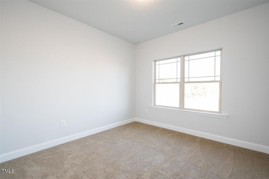 Representative unfurnished interior of a home built from the 2316 by Adams Homes in Hidden Pines, Cameron (Image 9).