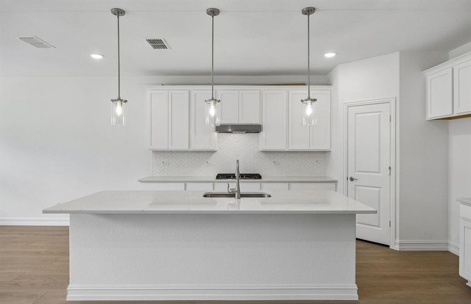 Beautiful kitchen with pendent lighting