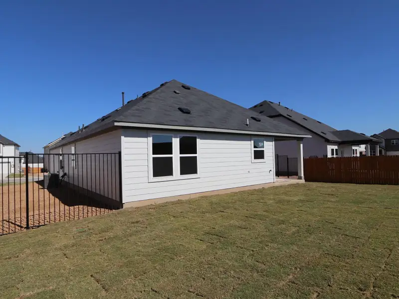 Exterior details and patio area of a home in Cascades at Onion Creek, Austin (Image 3).