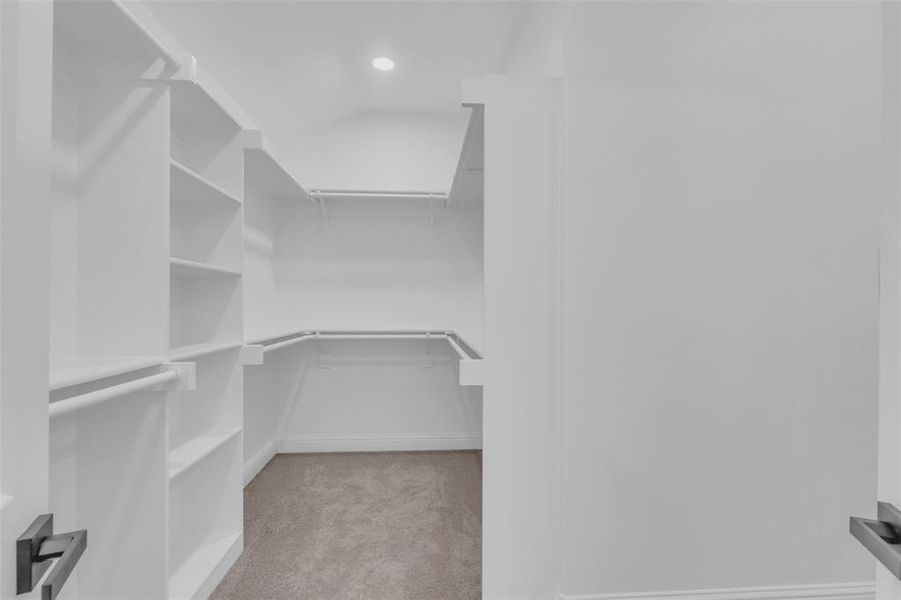 Generous primary bedroom walk-in closet