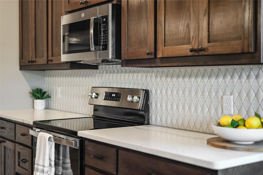 Beautiful decorative backsplash and rounded countertops