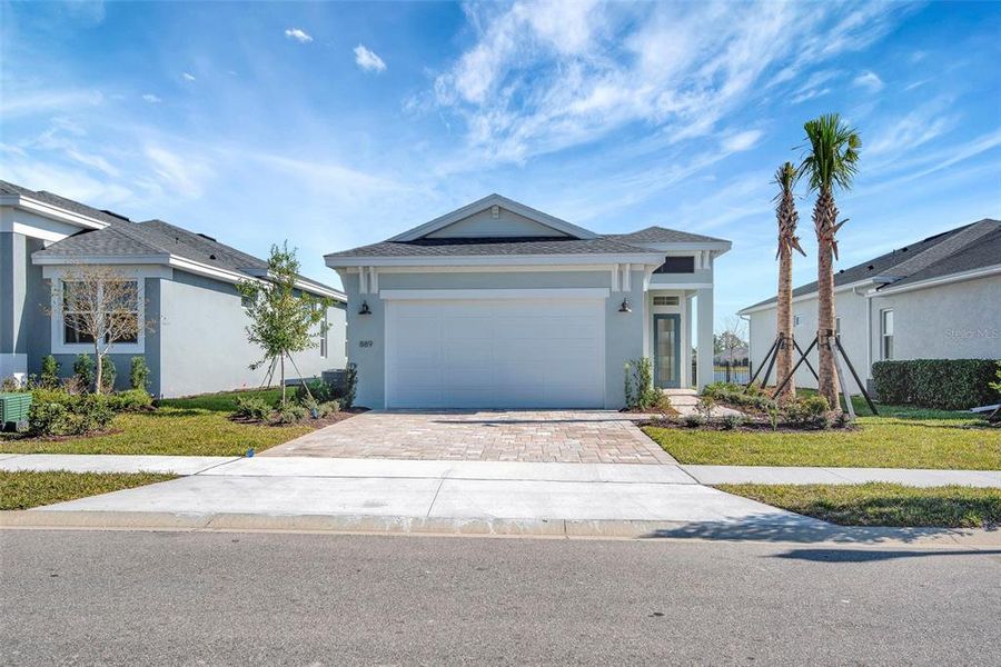 Front exterior of a new home in The Reserve at Victoria, Deland, FL, highlighting curb appeal (Image 24). Front exterior of a new home in The Reserve at Victoria, Deland, FL, highlighting curb appeal (Image 24).