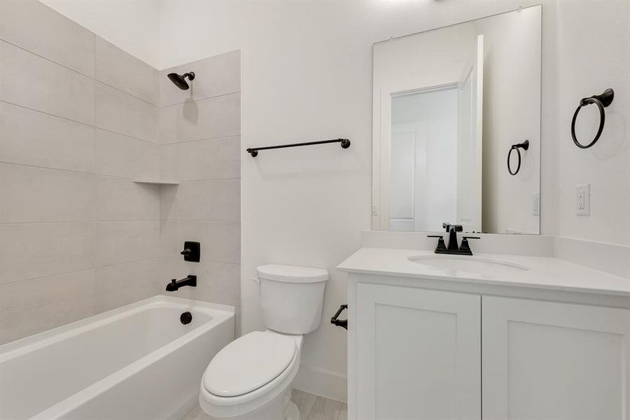 Full bathroom with bathtub / shower combination and vanity Full bathroom with bathtub / shower combination and vanity