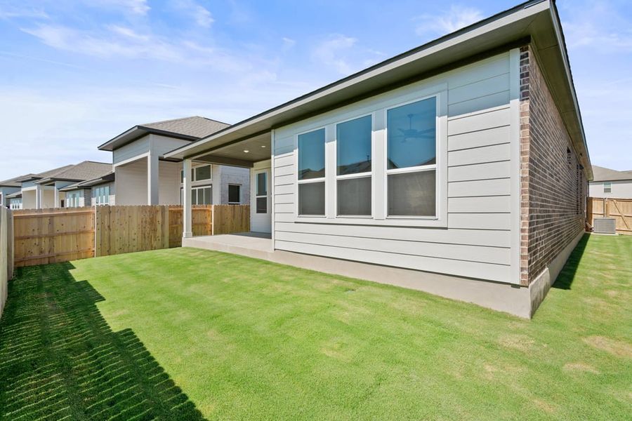 Exterior details and patio area of a home in Arbor Collection at Lariat, Liberty Hill (Image 25).