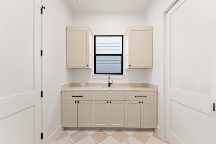 Laundry Room. *Previous project by the same developer, floor plans and selections may vary.*
