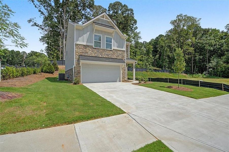 Front exterior of a new home in Sawmill Creek, Mableton, GA, highlighting curb appeal (Image 24).