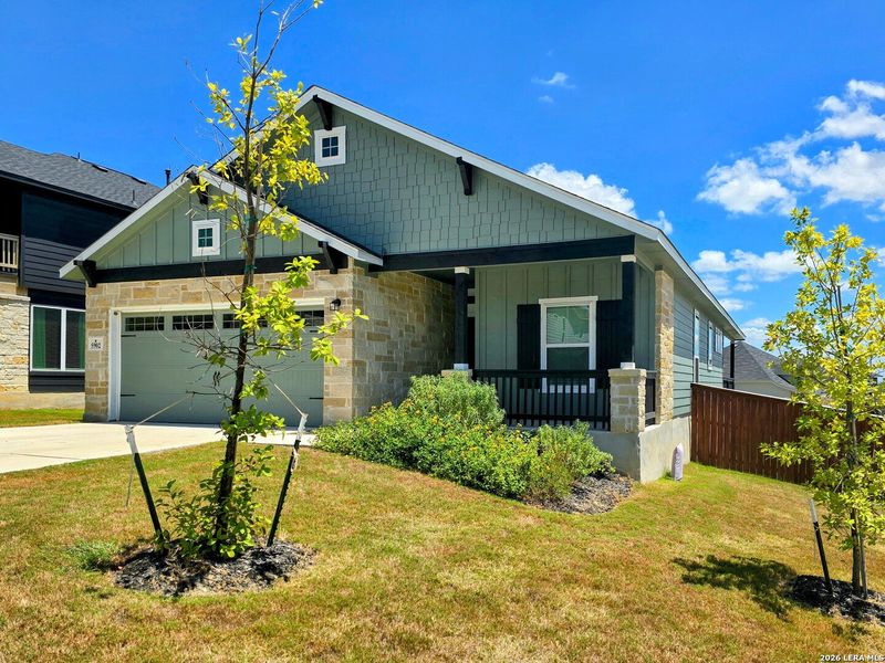 Front exterior of a new home in Homestead, Schertz, TX, highlighting curb appeal (Image 24).
