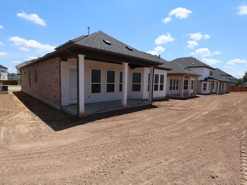 Front exterior of a new home in Edgewood, Leander, TX, highlighting curb appeal (Image 2).