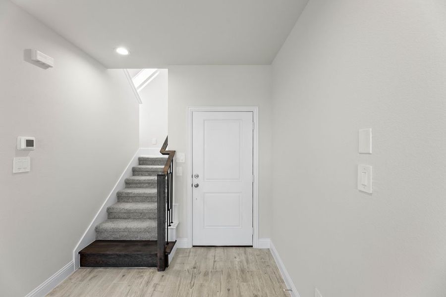 Front exterior of a new home in Main Street Village, Mansfield, TX, highlighting curb appeal (Image 5).
