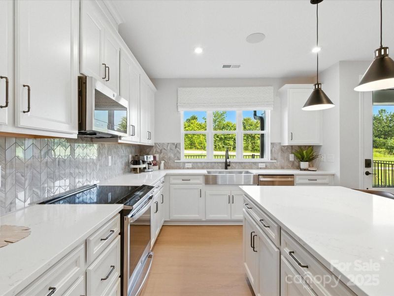 Expansive counter space and cabinetry for all your storage needs. *Model Photos | Actual finishes, orientation, and structural selections may vary.