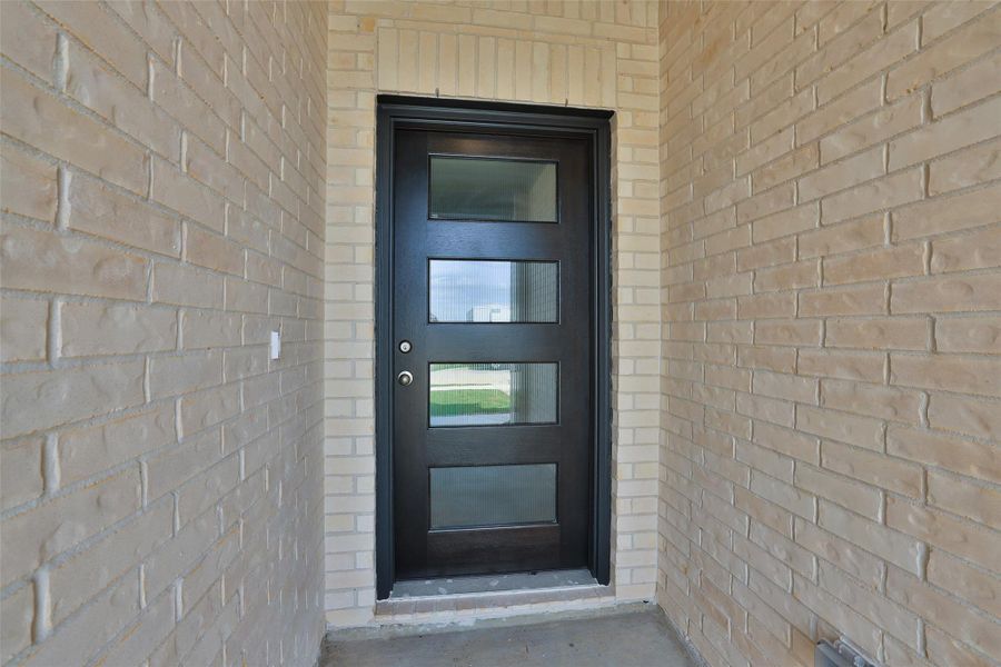 Exterior details and patio area of a home in Sunterra, Katy (Image 20).