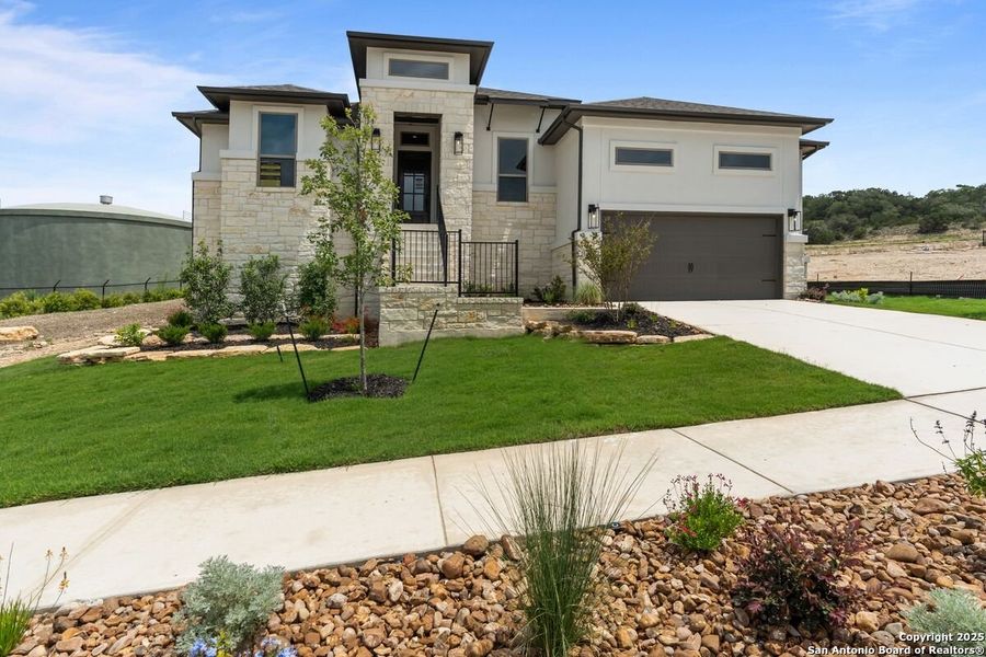 Front exterior of a new home in Esperanza - 70', Boerne, TX, highlighting curb appeal (Image 2).