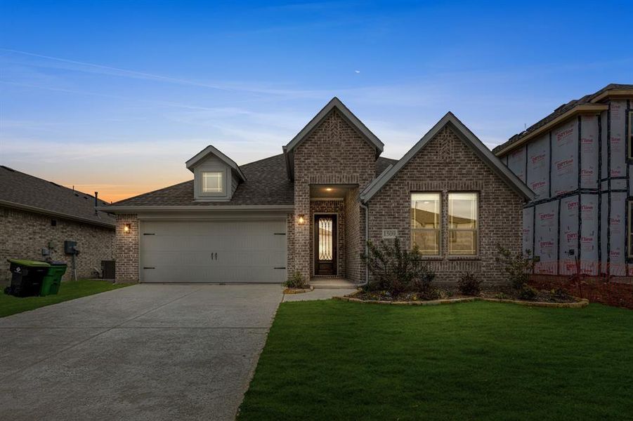 Front exterior of a new home in ArrowBrooke, Aubrey, TX, highlighting curb appeal (Image 2).