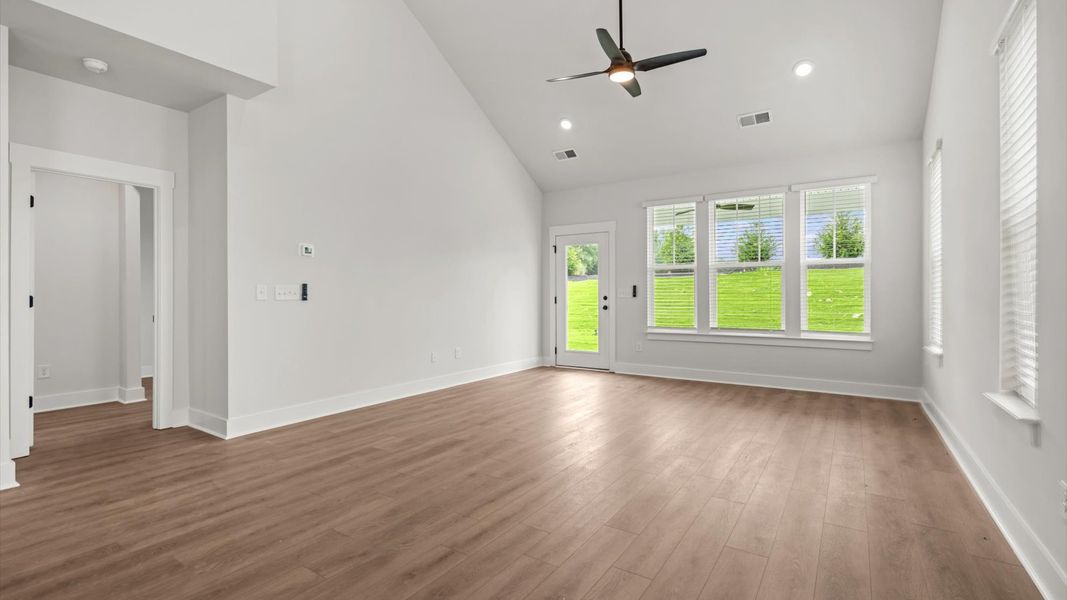 First-class living space featuring expansive ceilings, elegant design, and open sightlines to the kitchen