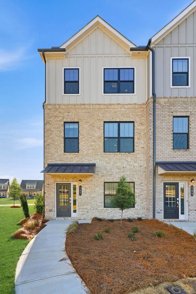 Front exterior of a new home in The Encore, Perry, GA, highlighting curb appeal (Image 1). Front exterior of a new home in The Encore, Perry, GA, highlighting curb appeal (Image 1).