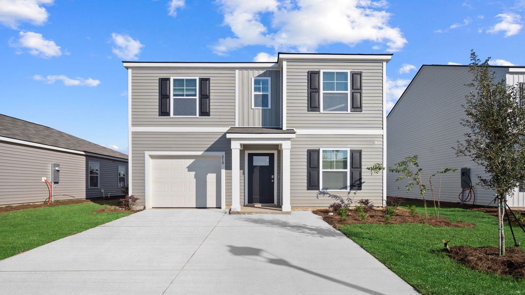 Representative exterior photo of a completed home built from the Hartsville by D.R. Horton in The Retreat at East Argent, Ridgeland, SC (Image 19).
