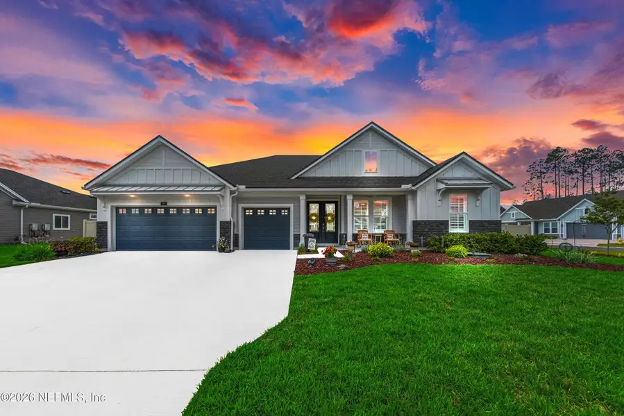 Front exterior of a new home in , St. Johns, FL, highlighting curb appeal (Image 2). Front exterior of a new home in , St. Johns, FL, highlighting curb appeal (Image 2).