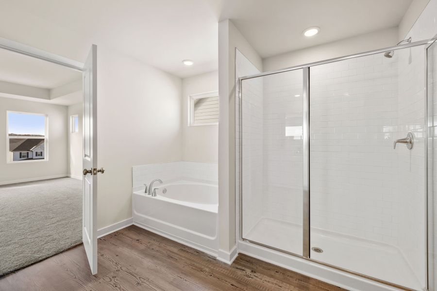A bathroom with a glass shower. A bathroom with a glass shower.