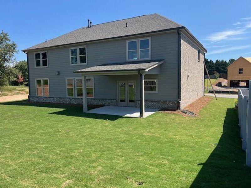 Front exterior of a new home in Sierra Lake, Cumming, GA, highlighting curb appeal (Image 19). Front exterior of a new home in Sierra Lake, Cumming, GA, highlighting curb appeal (Image 19).