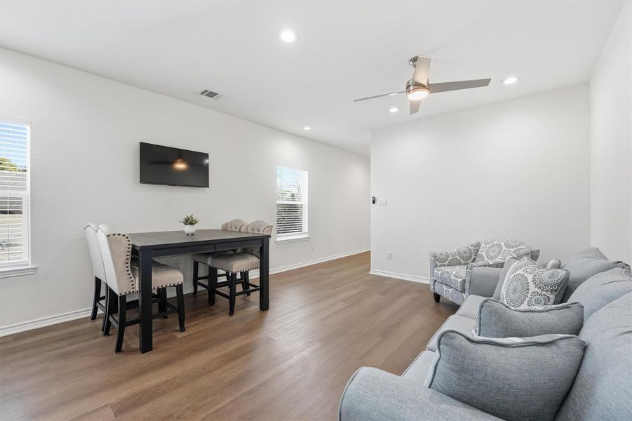 Another angle of the living area emphasizes the open-concept design, showing how easily the space accommodates gathering, lounging, or hosting with comfort and ease.