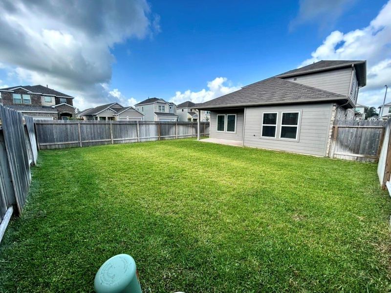 Front exterior of a new home in Enclave at Dobbin, Magnolia, TX, highlighting curb appeal (Image 2).