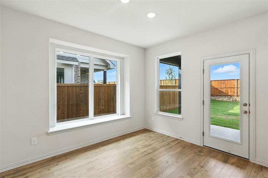 Entryway featuring hardwood / wood-style floors, healthy amount of natural light, and recessed lighting