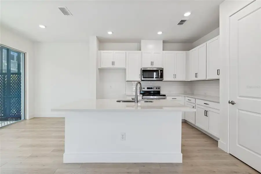 Furnished interior view inside a new home in North River Ranch – Townhomes, Parrish (Image 7).