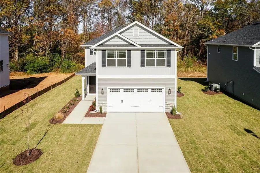 Front exterior of a new home in Magnolia Villas, Cornelia, GA, highlighting curb appeal (Image 2). Front exterior of a new home in Magnolia Villas, Cornelia, GA, highlighting curb appeal (Image 2).